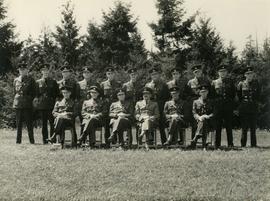 Officers on their graduation day from the B.C. Police School; Earl Sarsiat center, back row