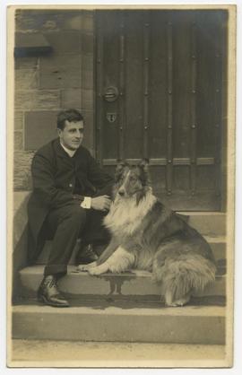A man and dog sitting on the steps of a church