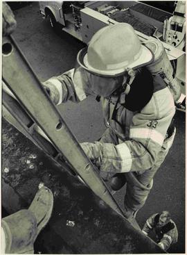 Sgt Derek Reid climbing ladder in a drill