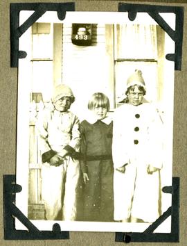 Children in costume in front of 493 Lampson Street