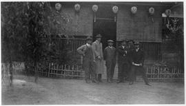 Group of men in front of Teahouse