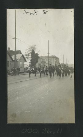 Brass section of band marching in parade on Fort Street, Victoria