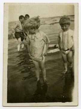 Children wading in ocean