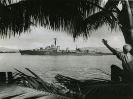Soldier waving to an unknown ship off the coast of Hawaii
