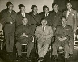 B.C. Provincial Police officers and unidentified men; Earl Sarsiat in back row, left center
