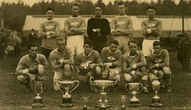 Esquimalt soccer team with trophies in Bullen Park; Jim Worswick far right