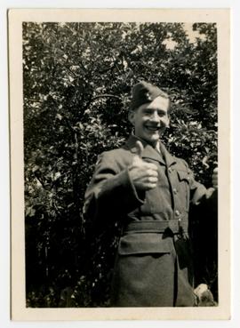 Man in uniform giving thumbs up