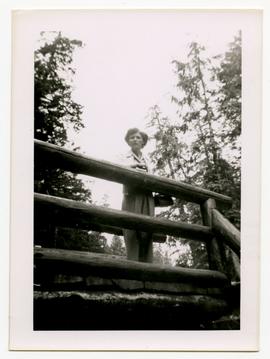 Emily Harrop standing on a wooden bridge