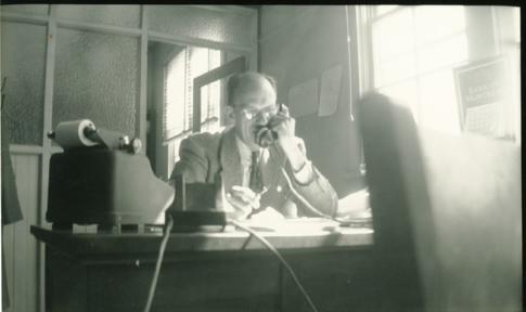 Photo of Mr. Bickerton on phone in Municipal Hall, ID 000-05-30