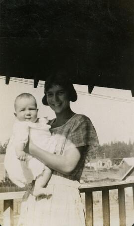 Woman with baby on front porch