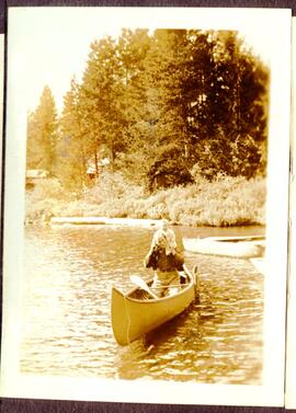 Man and baby in a canoe