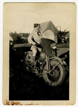 Man in military uniform on a motorcycle
