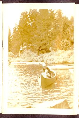 Woman and baby in canoe