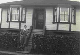Eric Hall in front of family home on Juno St.