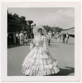 Woman wearing a large dress for a parade