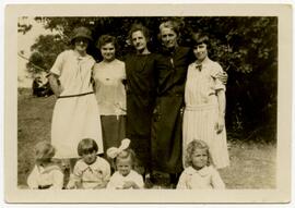 Group of women and young girls posing in a park