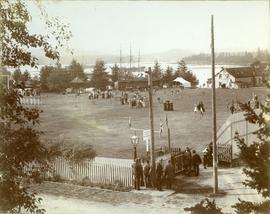 Canteen grounds with three masted ship in harbour