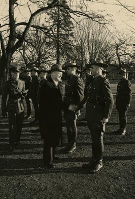 B.C. Provincial Police officers on grounds of Christ Church Cathedral, shaking hands with Attorne...