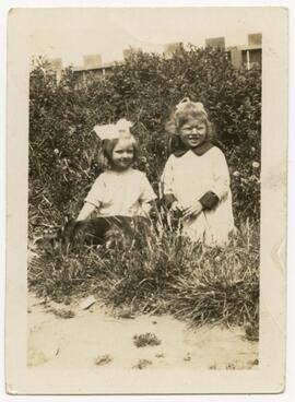 Young girls with dog in the garden