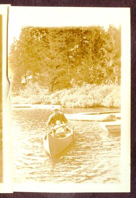 Man and baby in a canoe