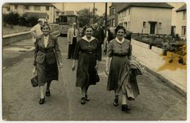 Women walking down a street