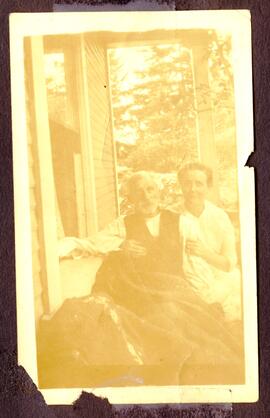 Elderly couple sitting on a porch swing