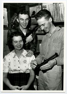 Three unidentified people in Ralph Wherry's gun shop, 1300 block, Esquimalt Rd.