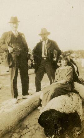 Four people on a beach