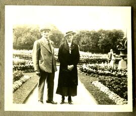Man and woman on pathway in garden