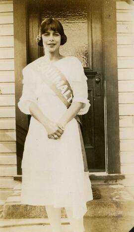Woman wearing "Esquimalt" sash