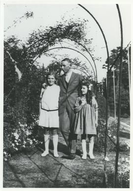 Daphne and Phyllis Pooley with family friend from Royal Navy in "Fernhill" garden