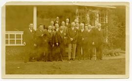 Golf club members standing in front of the clubhouse