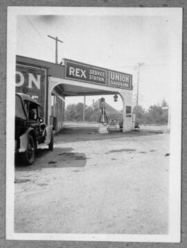 Rex Service Station, Esquimalt Rd at Comerford Street.  Pat Comerford, proprietor c. 1930.