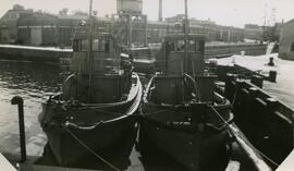 Naval tugs Glendon and Grendevon tied to dock