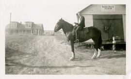 Gerry Bishop, Yarrows employee, on horseback at Francois Lake