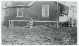 Shirley Filewod standing next to home