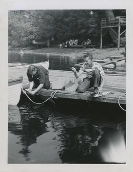 Jack Weber (left) and unidentified man on wharf